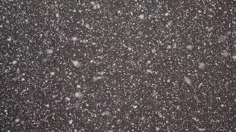 Falling down real snowflakes, heavy snow, snowstorm weather, shot on darck Stock Footage 84795518