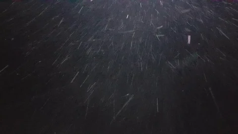 Falling down real snowflakes, heavy snow, snowstorm weather, shot on black Stock Footage 100041789