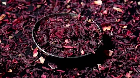 Falling Dried leaves of hibiscus red dry tea background, close up. rotation. Stock Footage 204158735