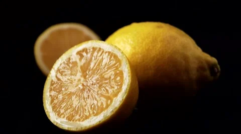 Falling Drops On Closeup Lemon On A Black Background Stock Footage 52120422