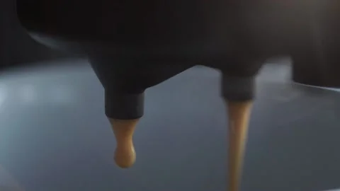 Falling drops of coffee into a cup. coffee drops drip from the filter holder Stock Footage 201291752