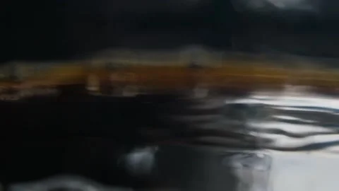 Falling drops of coffee in slow motion Video stock 143008723