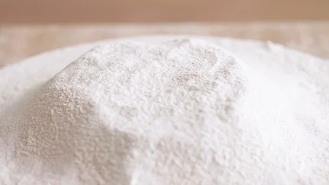 Falling egg yolk into flour Stock-Footage 102544178