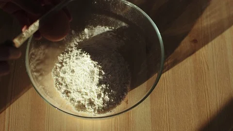 Falling eggs into flour. Sun light 스톡 동영상 70942906