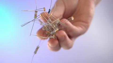 Falling electrical parts on a transparent surface, bottom view. Stock Footage 171406749
