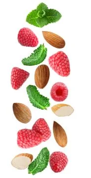 Falling fresh berries with mint and almonds isolated on white Stock Photos