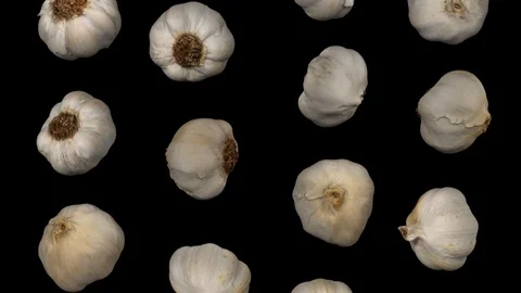 Falling Garlic Heads on Black Background (Looping) Stock Footage 95097743