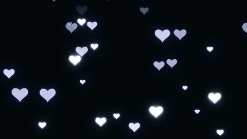 Falling glowing white heart shapes ascend against dark background Stock Footage 327506845