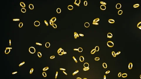 Falling Gold Rings on a Black Background 库存影片 72299694