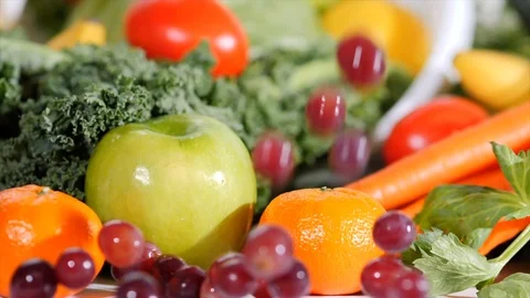 Falling Grapes with Fruit and Vegetable Background Stockbeeldmateriaal 105138962