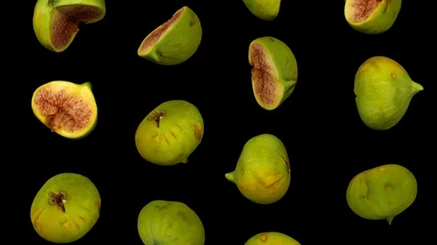Falling Green Figs on Black Background (Looping) Stock Footage 95099481