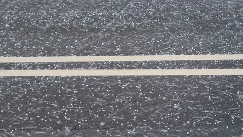 Falling hail on the driveway Stock Footage 151977770