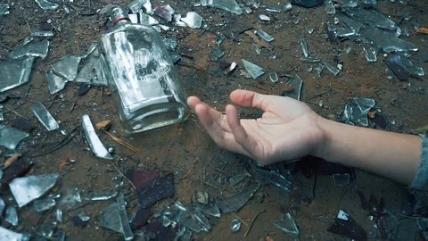 Falling Hand with Bottle. death from alcohol Video stock 80860485