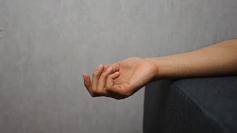 Falling hand down on bed in slow motion speed Video stock 90385866