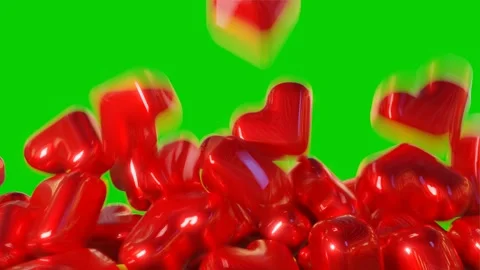 Falling hearts on a green screen. Stock Footage 257606914