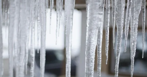 Falling icicle, due to high temperature and melting ice and snow. Stock Footage 127183438
