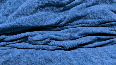 Falling knit fabric bunching and piling up Video stock 340420400