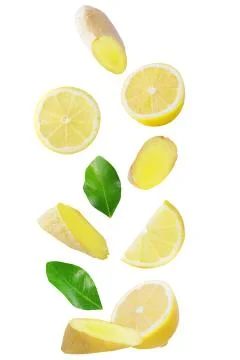 Falling lemon and ginger isolated on white Stock Photos