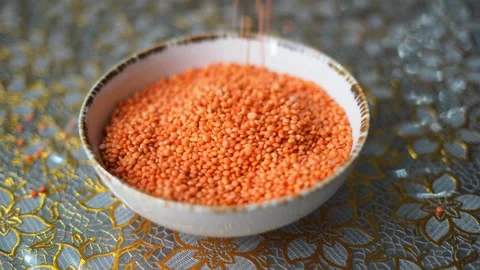 Falling lentils in a bowl Stock Footage 332688795