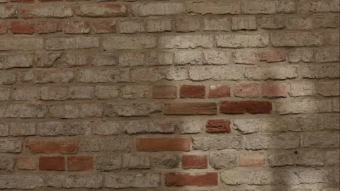 Falling light shaped window moving along brick wall, time-lapse. Video stock 306643270