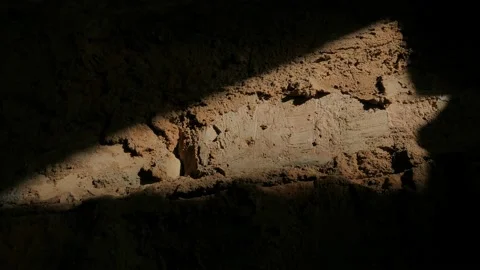 Falling light from a window moves along a brick wall, time lapse. Stock Footage 150053816