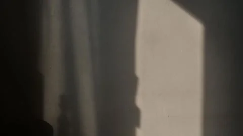 A falling light from a window moves along the wall. Video stock 304248174