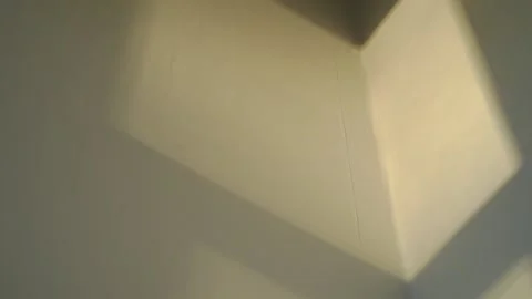 A falling light from a window moving along the wall. Stock Footage 144656182