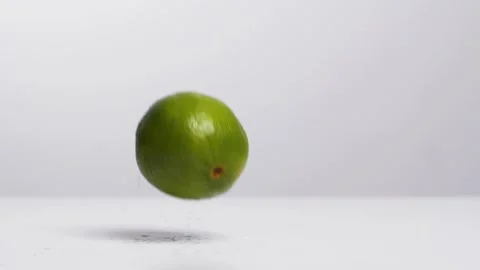 Falling a lime on the ground Stock Footage 132861407