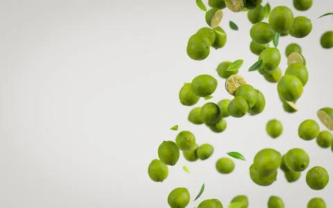 Falling limes on gray background. Minimalistic sales design Foto stock