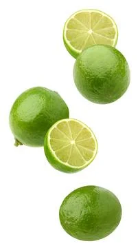 Falling limes isolated on a white background with a clipping path. Stock Photos
