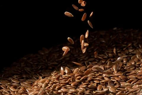 Falling linseeds spread middle Stock Photos