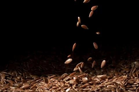 Falling linseeds spread right Stock Photos