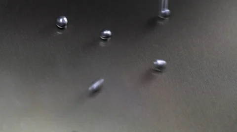 Falling little iron balls Stock Footage 36003907