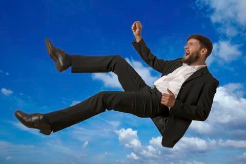 Falling man in sky, studio shot Stock Photos