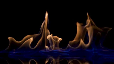 Falling match causes flames to ignite against black studio background Stock Footage 165898981