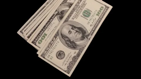 Falling money - stack of dollars on a black background Stock Footage 221900770