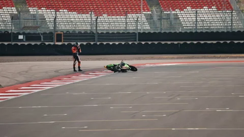 Falling from a motorcycle while training on a race track, crash Stock Footage 295021541