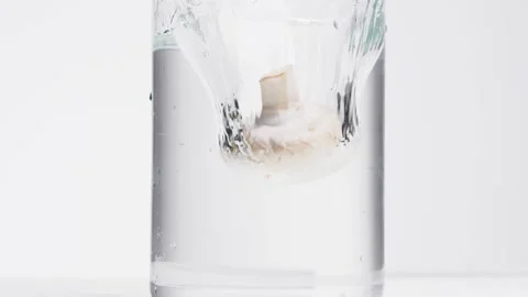 Falling a mushroom in the water Stock Footage 132861384