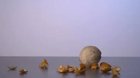 Falling orange peels and rolling oranges Stock Footage 43668142