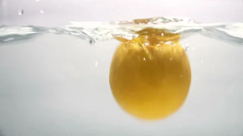 Falling Orange in the Water 4K Stock Footage 46351571