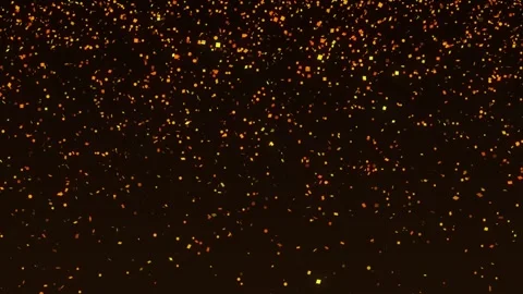 Falling orange, yellow, and gold confetti on a dark background. Vídeos de archivo 304863574