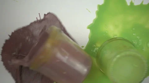 Falling paint jars in slow motion Stock Footage 99841197