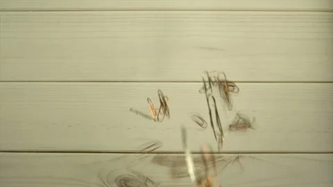 Falling paper clips slow motion Stock Footage 101862896