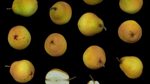 Falling Pears on Black Background (Looping) Stock Footage 95097440