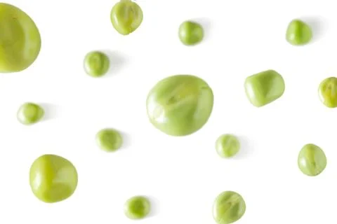 Falling peas on a white background. Scattered peas on a light background Stock Photos