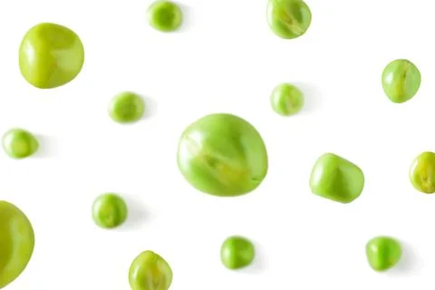 Falling peas on a white background. Scattered peas on a light background Stock Photos