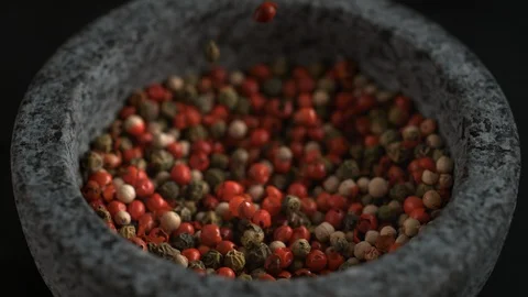 Falling peppercorn in mortar. Slow Motion. Stock Footage 87233409