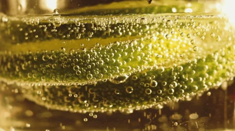 Falling pieces of lime in soda water Stock Footage 41252003