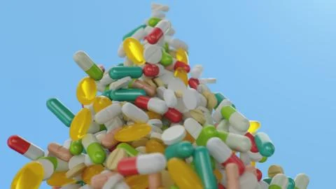 Falling pills, capsules on a blue background. Heap colorful pills. The rotating Stock Illustration