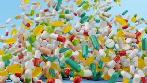 Falling pills, capsules on a blue background. Heap colorful pills. The rotating Stock Illustration